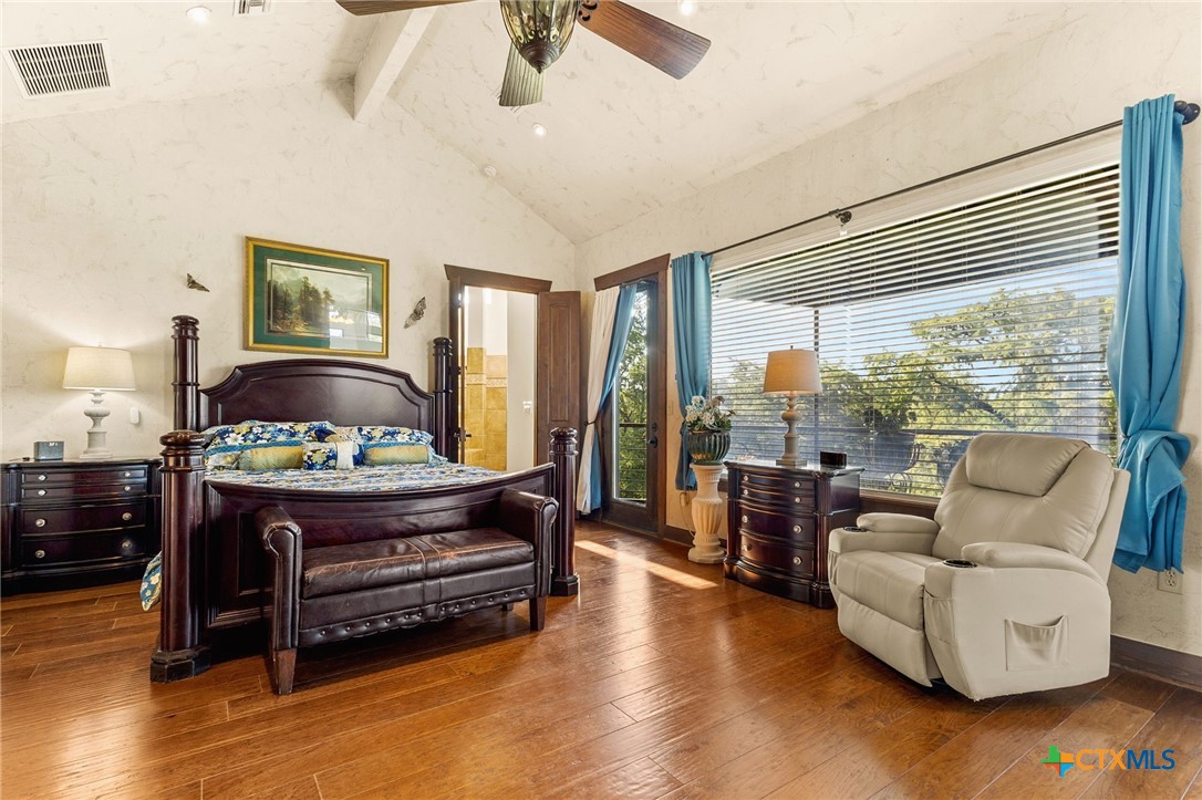 134 Bandit Beach Road New Braunfels, TX 78130 - Photo 24 of 46 a living room with furniture and a floor to ceiling window
