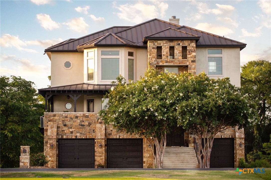 134 Bandit Beach Road New Braunfels, TX 78130 - Photo 3 of 46 a front view of a house with garden