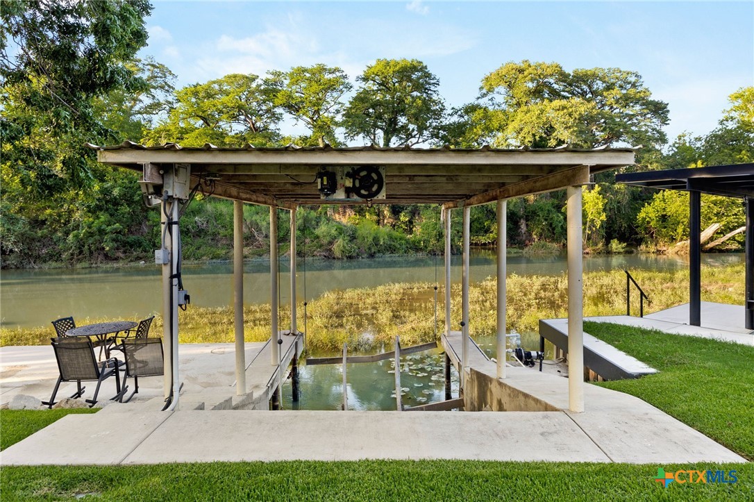 134 Bandit Beach Road New Braunfels, TX 78130 - Photo 38 of 46 a view of a swimming pool with a patio and a yard