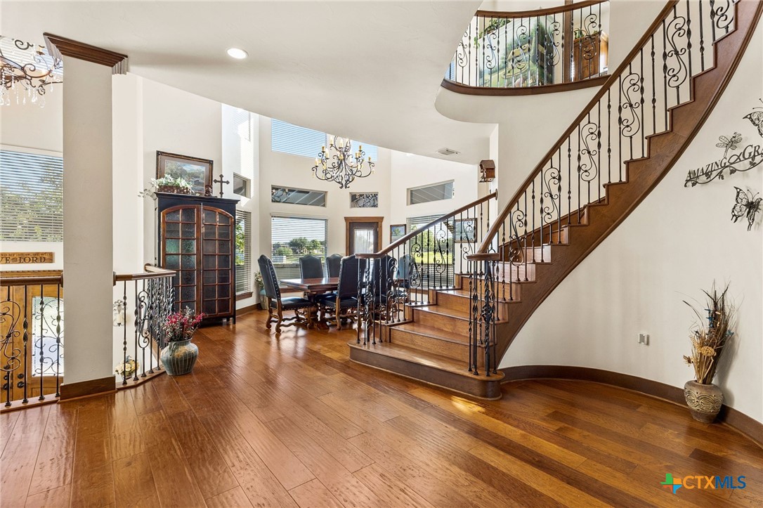 134 Bandit Beach Road New Braunfels, TX 78130 - Photo 4 of 46 a view of entryway with dining room and hall with wooden floor