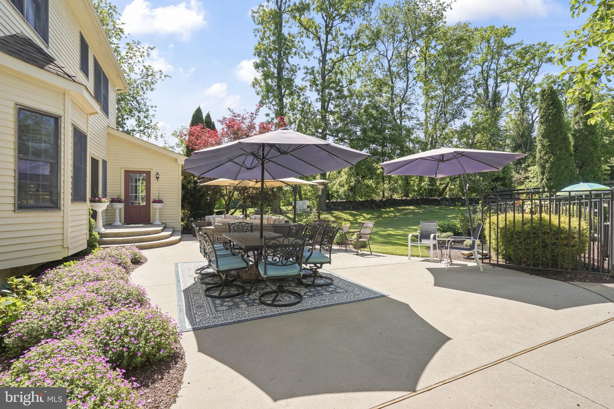 26 Ellisdale Road Allentown, NJ 08501 - Photo 38 of 45 Sunny patio oasis with lush greenery.