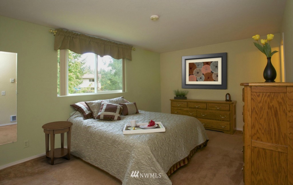 2517 166th Place Southeast Bothell, WA 98012 - Photo 11 of 20 a bedroom with a bed and a window