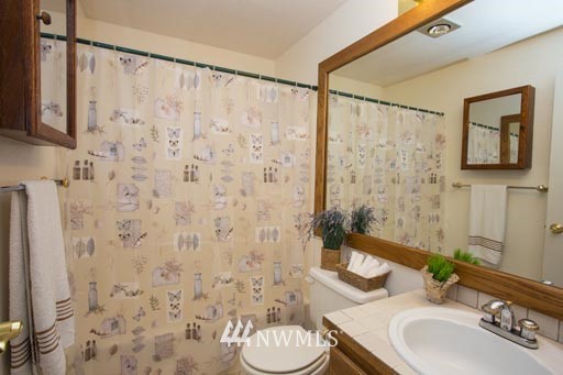 2517 166th Place Southeast Bothell, WA 98012 - Photo 12 of 20 a bathroom with a sink toilet and shower