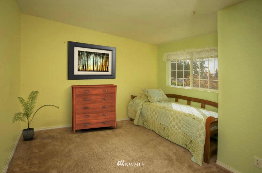 2517 166th Place Southeast Bothell, WA 98012 - Photo 14 of 20 a room with a couch and dresser