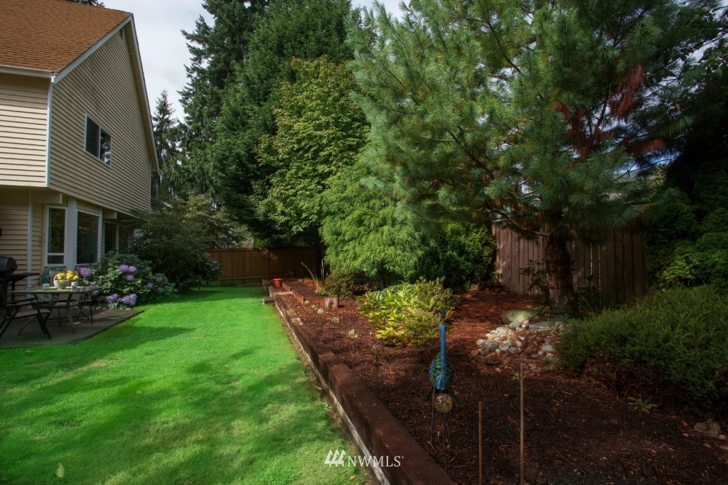 2517 166th Place Southeast Bothell, WA 98012 - Photo 17 of 20 a couple of table and chairs in the garden