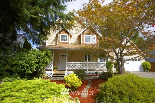 2517 166th Place Southeast Bothell, WA 98012 - Photo 20 of 20 a front view of a house with garden