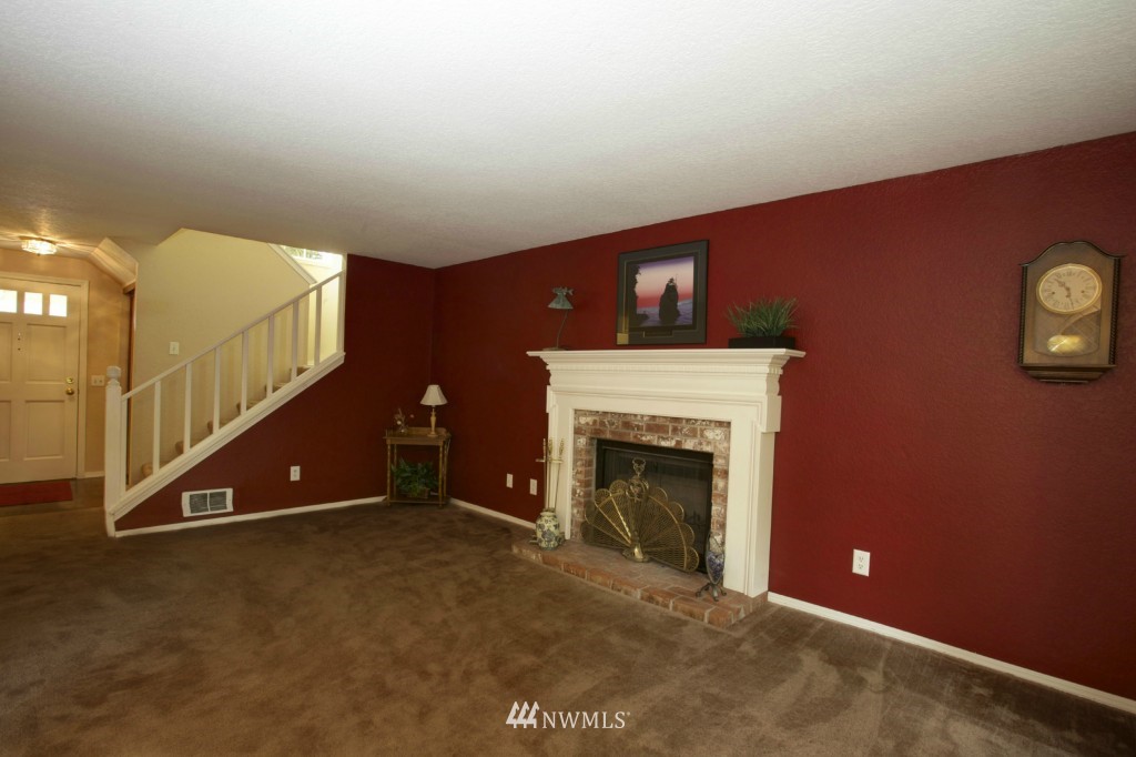 2517 166th Place Southeast Bothell, WA 98012 - Photo 5 of 20 a living room with furniture and a fireplace