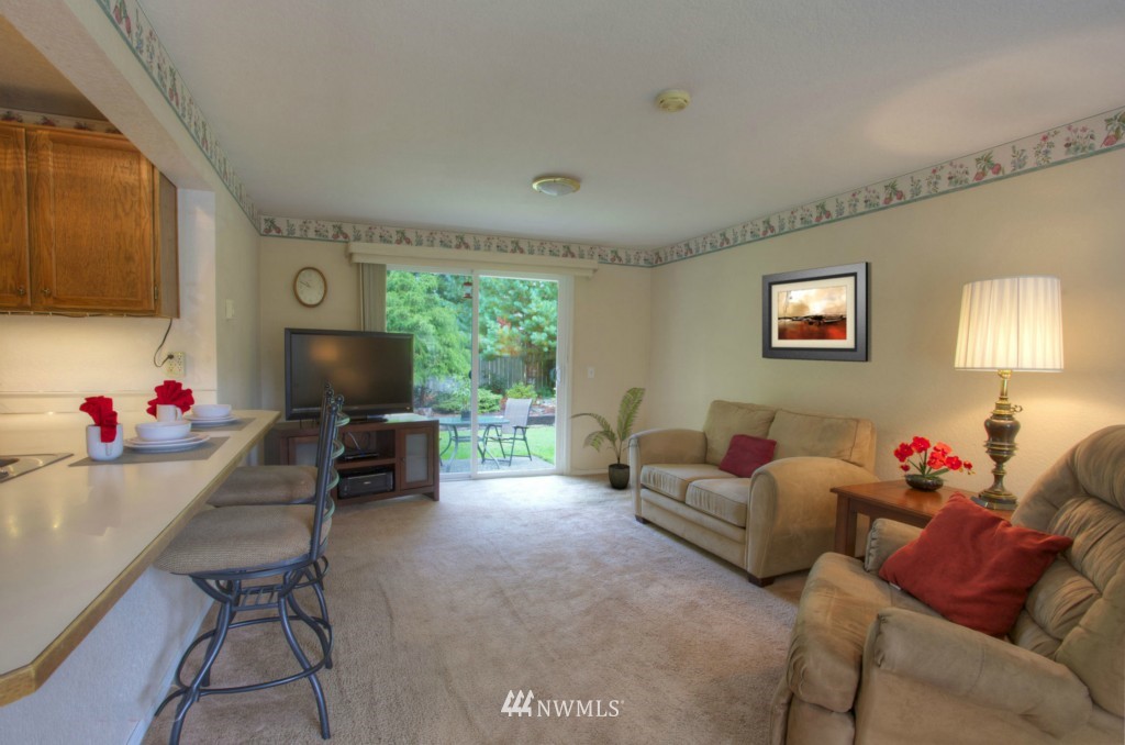 2517 166th Place Southeast Bothell, WA 98012 - Photo 9 of 20 a living room with furniture and a flat screen tv