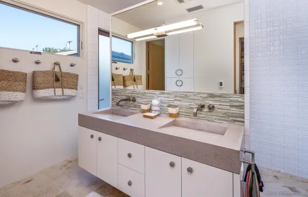 a bathroom with a sink and a mirror