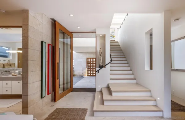 a view of entryway and hall with wooden floor