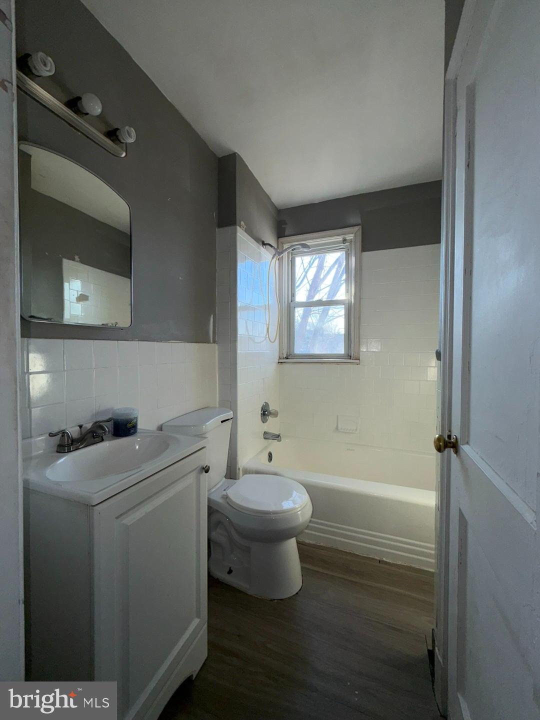 4027 Raymonn Avenue Baltimore, MD 21213 - Photo 13 of 19 a bathroom with a sink toilet and shower