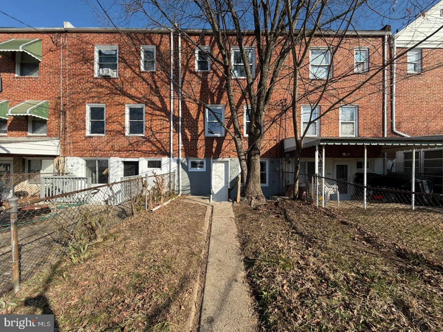 4027 Raymonn Avenue Baltimore, MD 21213 - Photo 18 of 19 a front view of a house with a yard