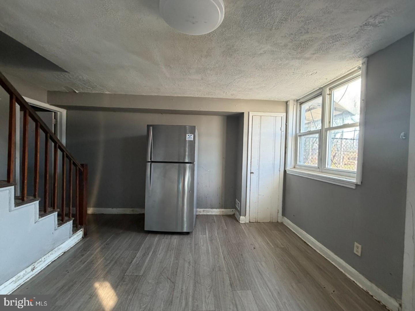 4027 Raymonn Avenue Baltimore, MD 21213 - Photo 9 of 19 a view of empty room with wooden floor and window
