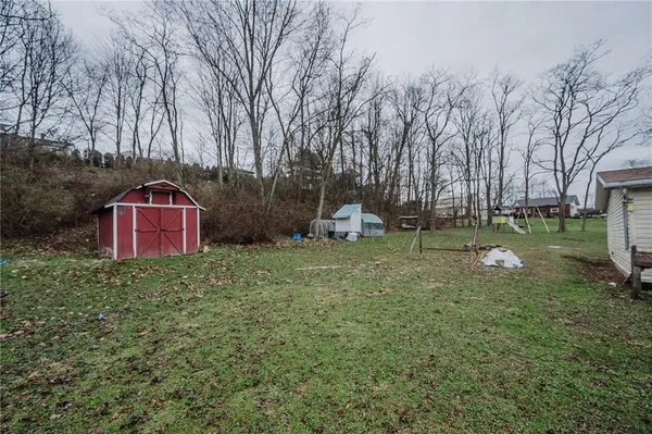 a backyard of a house with lots of green space