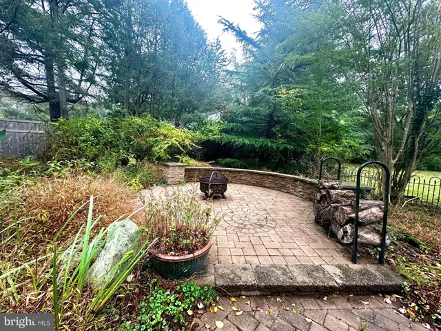 a view of a backyard with sitting area