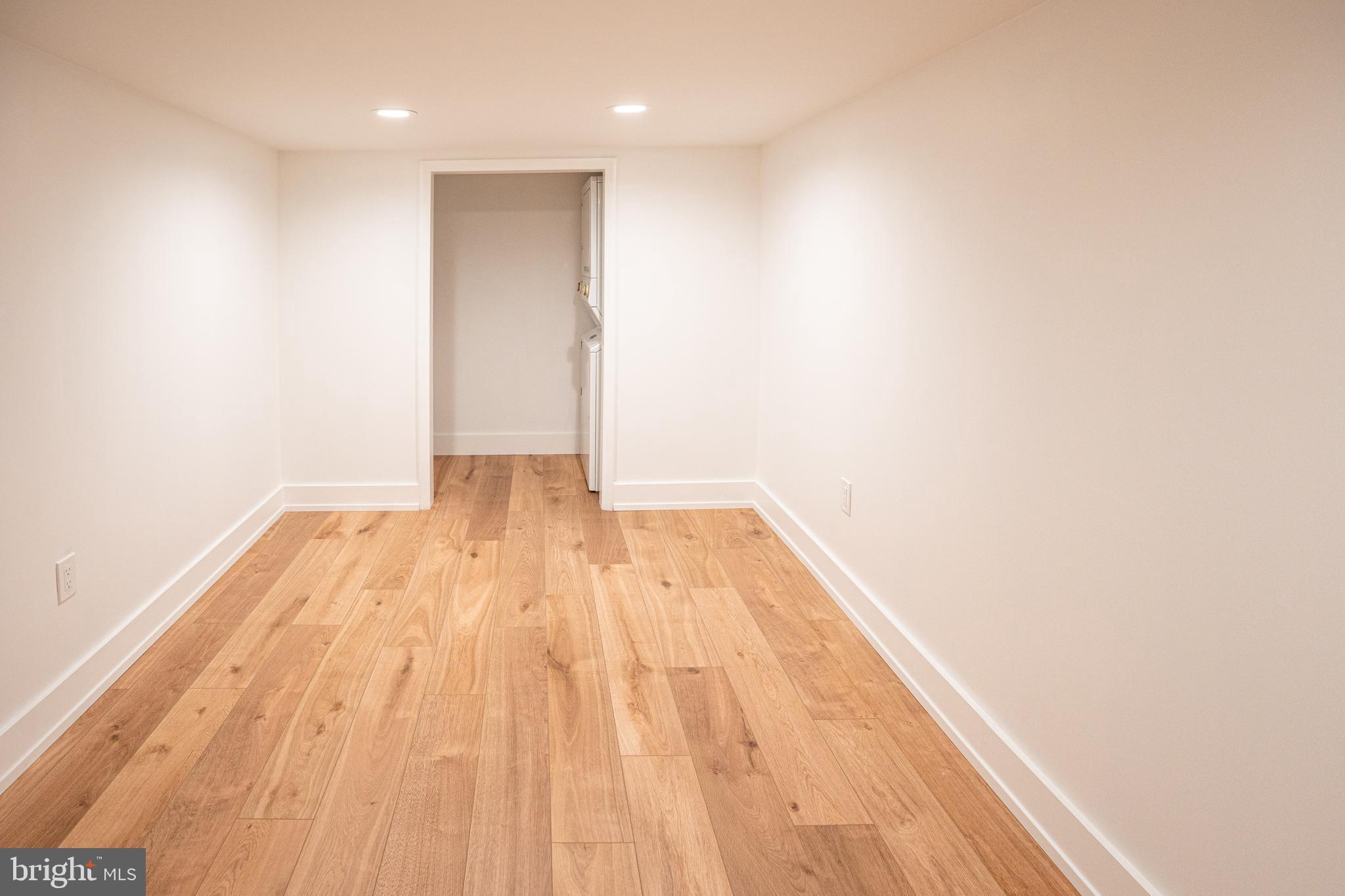 2538 East County Line Road, Unit 1 Ardmore, PA 19003 - Photo 14 of 16 a view of a room with wooden floor and white walls