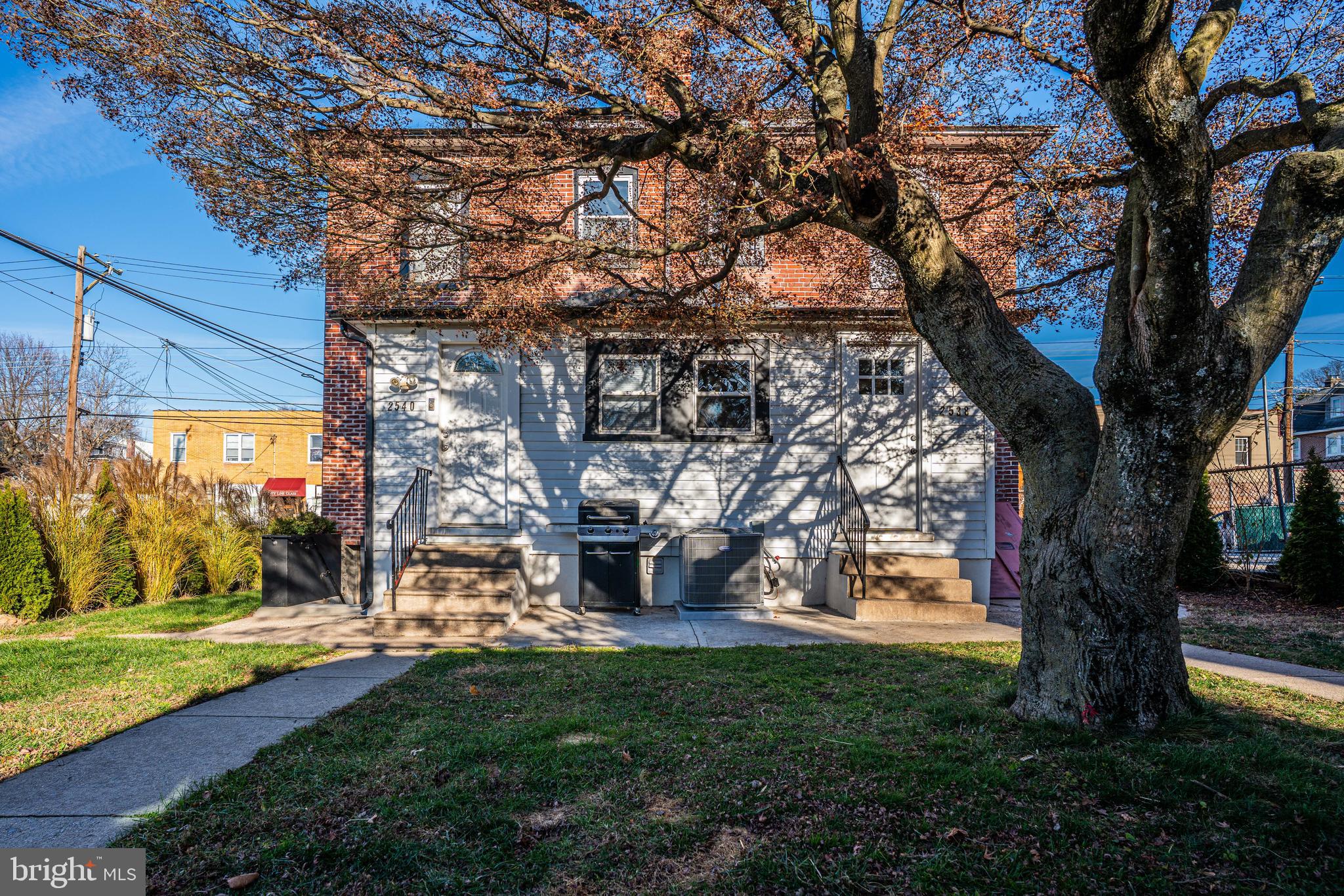 2538 East County Line Road, Unit 1 Ardmore, PA 19003 - Photo 16 of 16 a view of a yard with plants and large trees