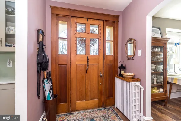 a view of a dining room with furniture and a bookshelf
