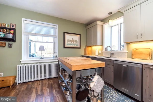 a bathroom with a sink vanity and a mirror