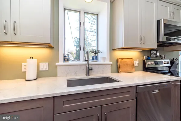 a view of front door and wooden floor