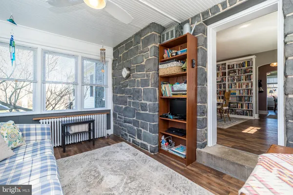 a bedroom with two beds and a table