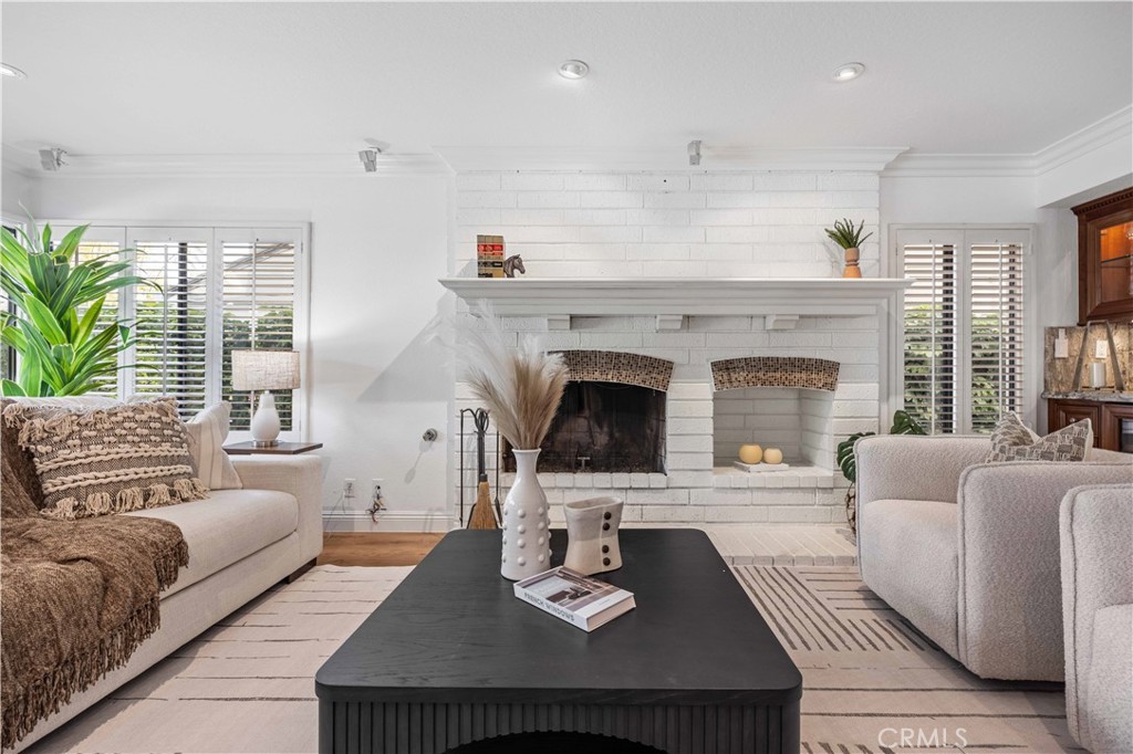 9 Hermosa Irvine, CA 92620 - Photo 12 of 20 a living room with furniture and a fireplace