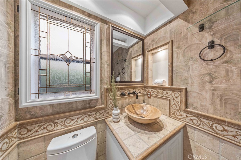 9 Hermosa Irvine, CA 92620 - Photo 14 of 20 a bathroom with a granite countertop sink mirror vanity and a bathtub