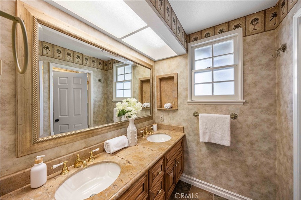 9 Hermosa Irvine, CA 92620 - Photo 15 of 20 a bathroom with a granite countertop sink and a mirror