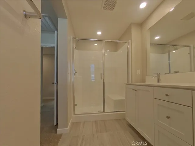a bathroom with a shower and a sink
