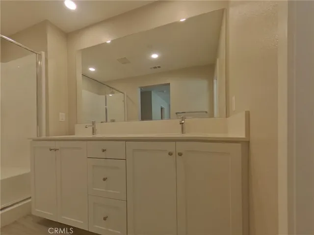 a bathroom with a sink and mirror