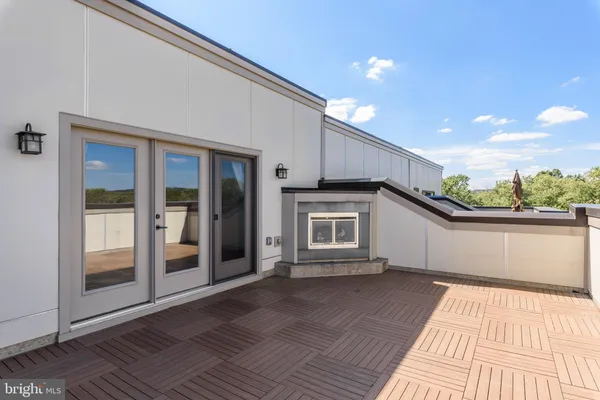 a view of a terrace with a glass door