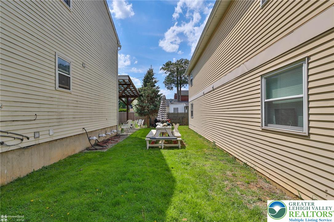 802 West Berwick Street Easton, PA 18042 - Photo 52 of 54 a backyard of a house with table and chairs