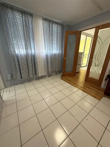 a view of an empty room and window