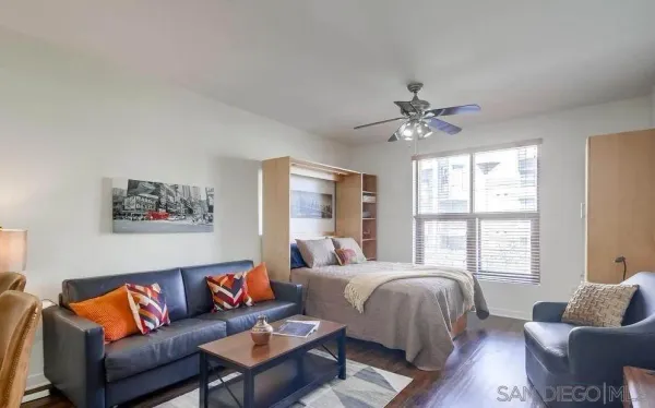 a living room with furniture and a large window