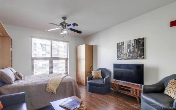 a living room with furniture and a window