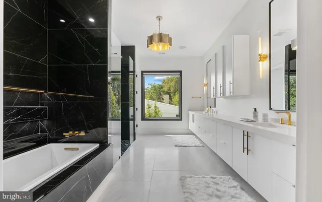 a bathroom with a glass shower door