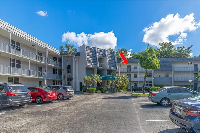 a view of cars parked in front of a building
