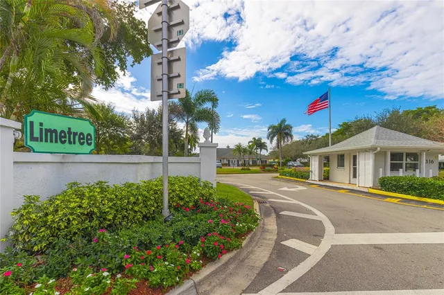 a view of a garden with a building in the background