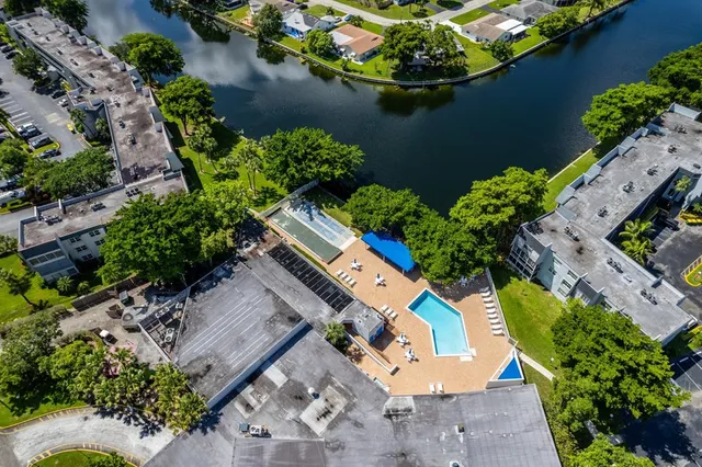 an aerial view of a house with a yard and a garden