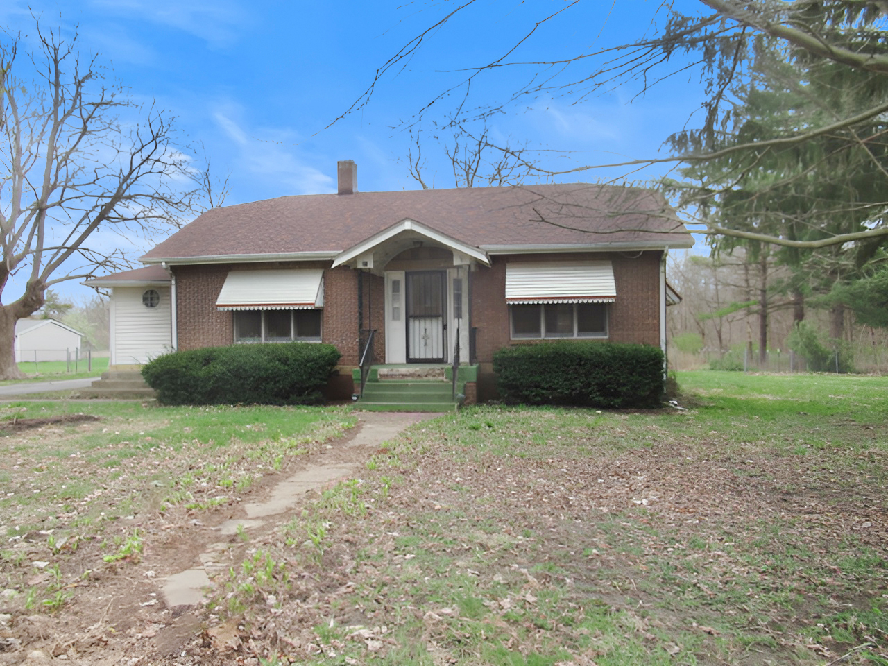 11 Dequimpal Street Westville, IL 61883 - Photo 1 of 21 a front view of a house with garden