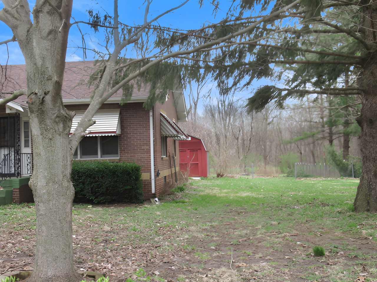 11 Dequimpal Street Westville, IL 61883 - Photo 5 of 21 a brick house with a tree in front of it