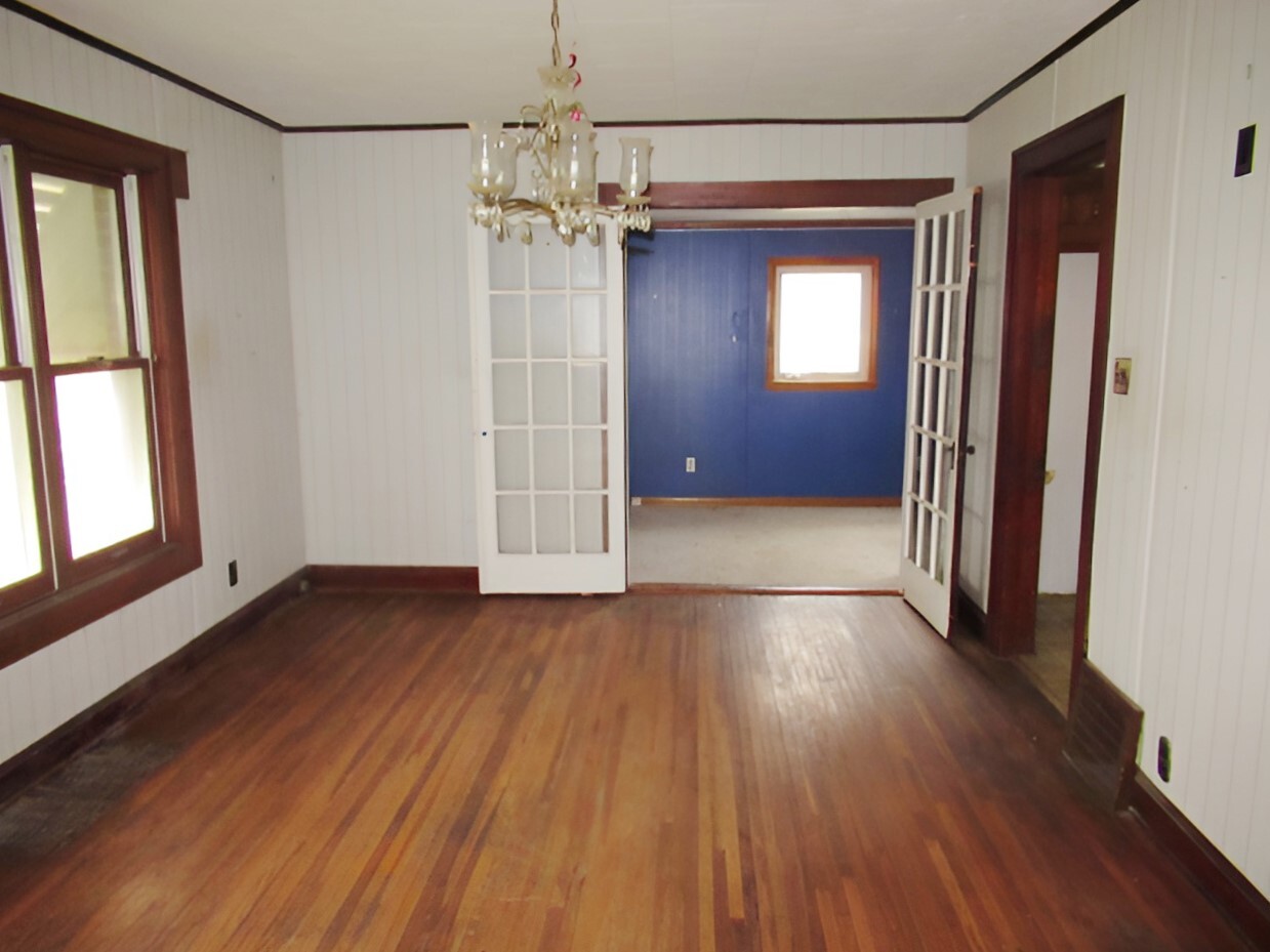 11 Dequimpal Street Westville, IL 61883 - Photo 8 of 21 wooden floor in an empty room with a window