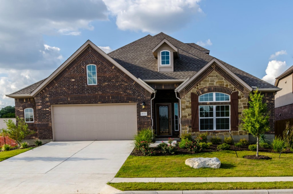 8732 Vantage Point Drive Austin, TX 78737 - Photo 1 of 1 a front view of a house with a yard