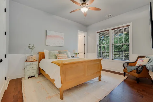 a bed room with a bed and a chandelier