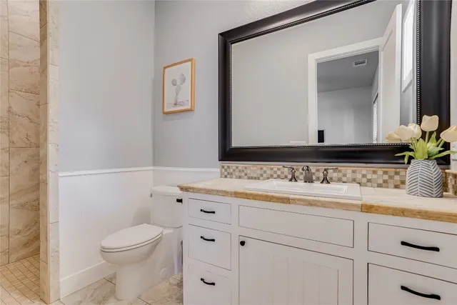 a bathroom with a sink and a toilet