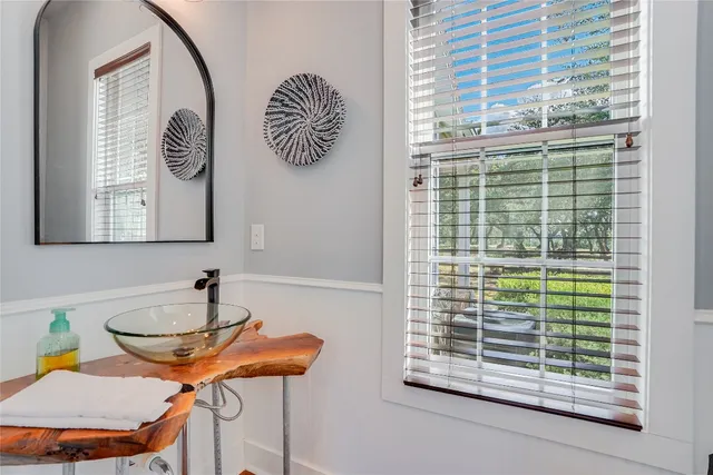 a dining room with furniture and a window