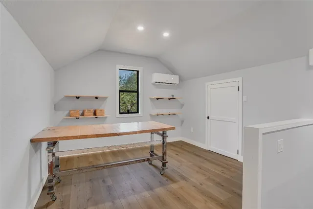 a room with a table and chairs