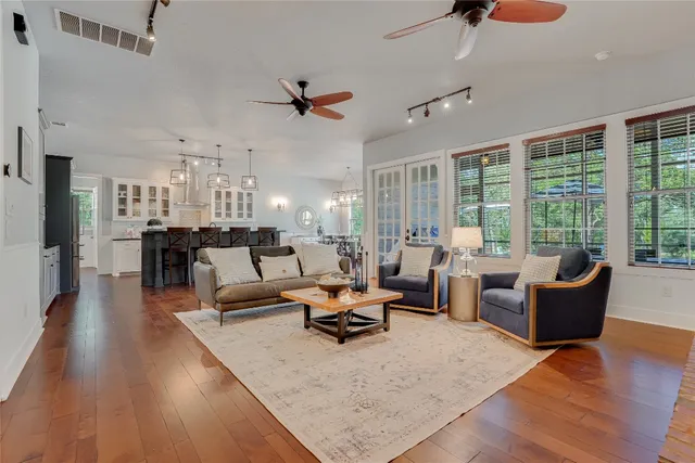 a living room with furniture or couch and a large window