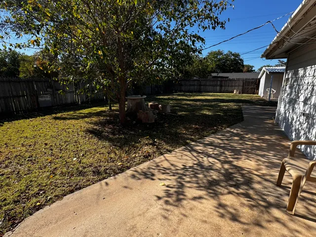 a view of outdoor space with backyard