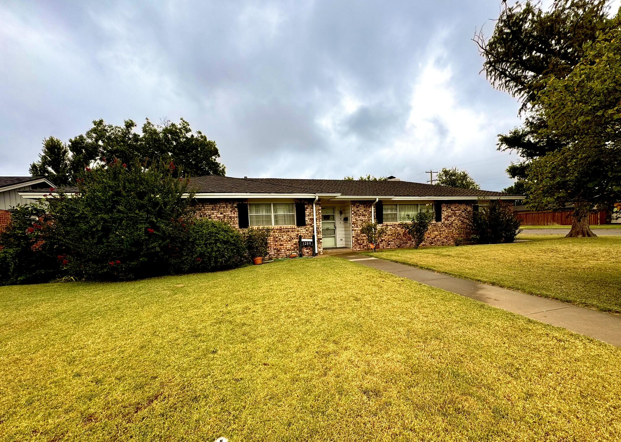 1209 Garland Plainview, TX 79072 - Photo 3 of 37 a front view of house with swimming pool